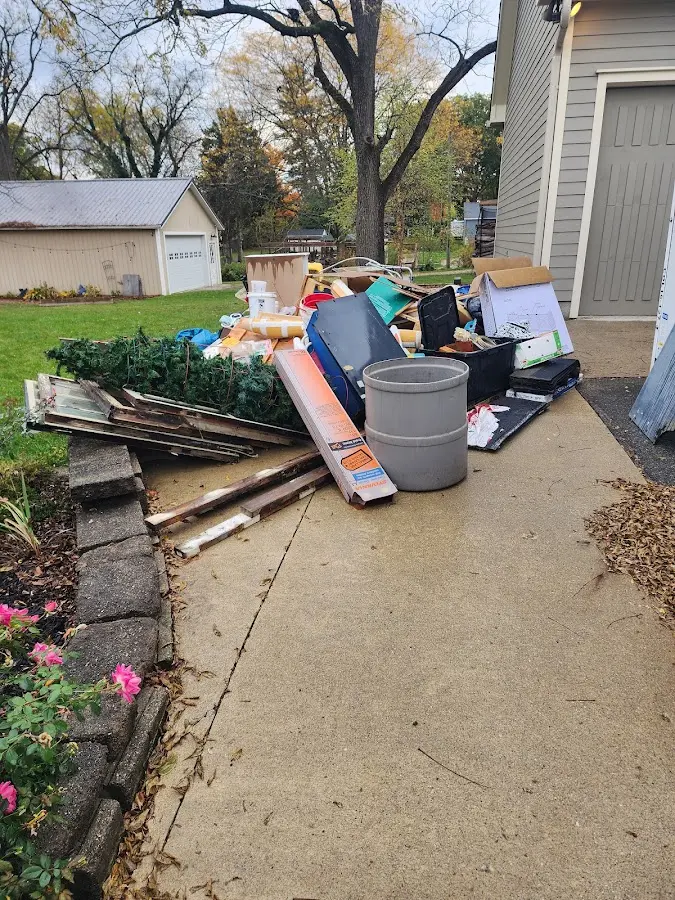 Dumpster being loaded with debris for Residential Dumpster Rental in Plaquemine